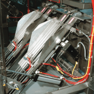 Two ganged Tolomatic actuators center the bags in the staging trays while two other actuators adjust the vertical position